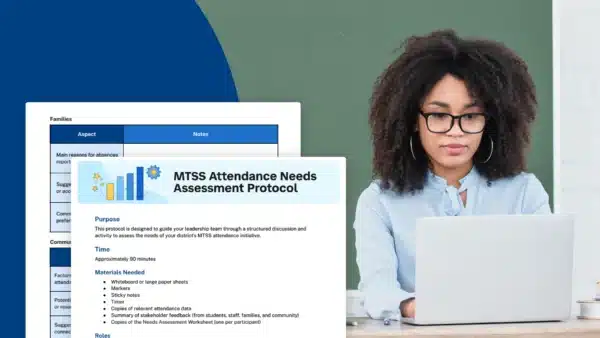 Female administrator with glasses working on a laptop with MTSS worksheet displayed next to her.